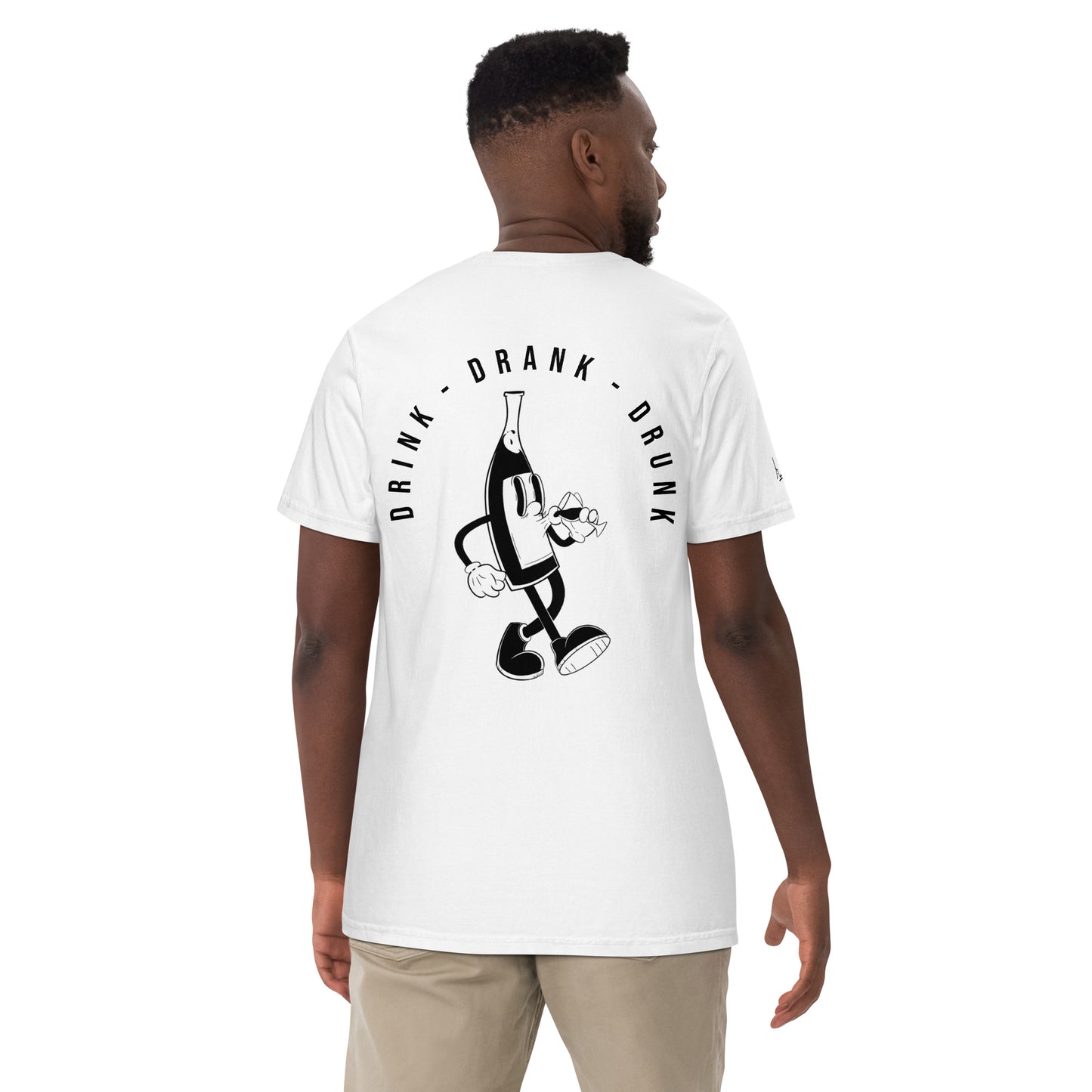 "White t-shirt with black cartoon-style print of a walking wine bottle holding a glass, surrounded by the words 'Drink Drank Drunk' in bold text."