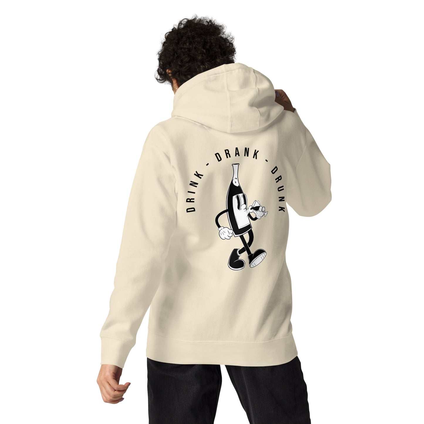 "beige t-shirt with black cartoon-style print of a walking wine bottle holding a glass, surrounded by the words 'Drink Drank Drunk' in bold text."