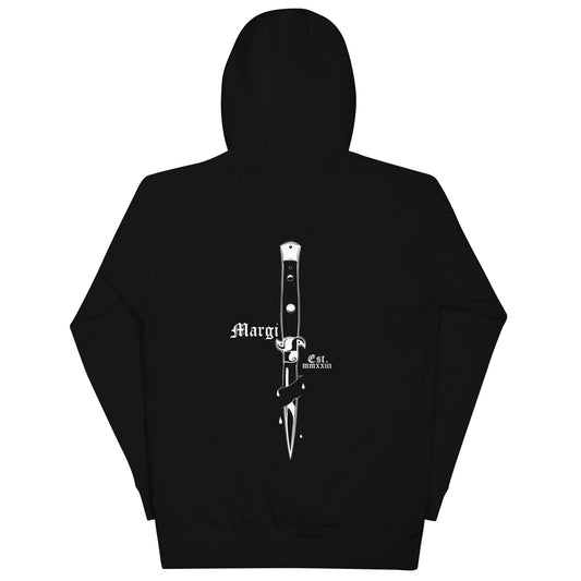 Zwarte hoodie met witte print van een cartoonstijl vlinder­mes met gezicht, omlijst door gothic tekst 'Margi' en 'Est. MMXXIII' op de rugzijde.